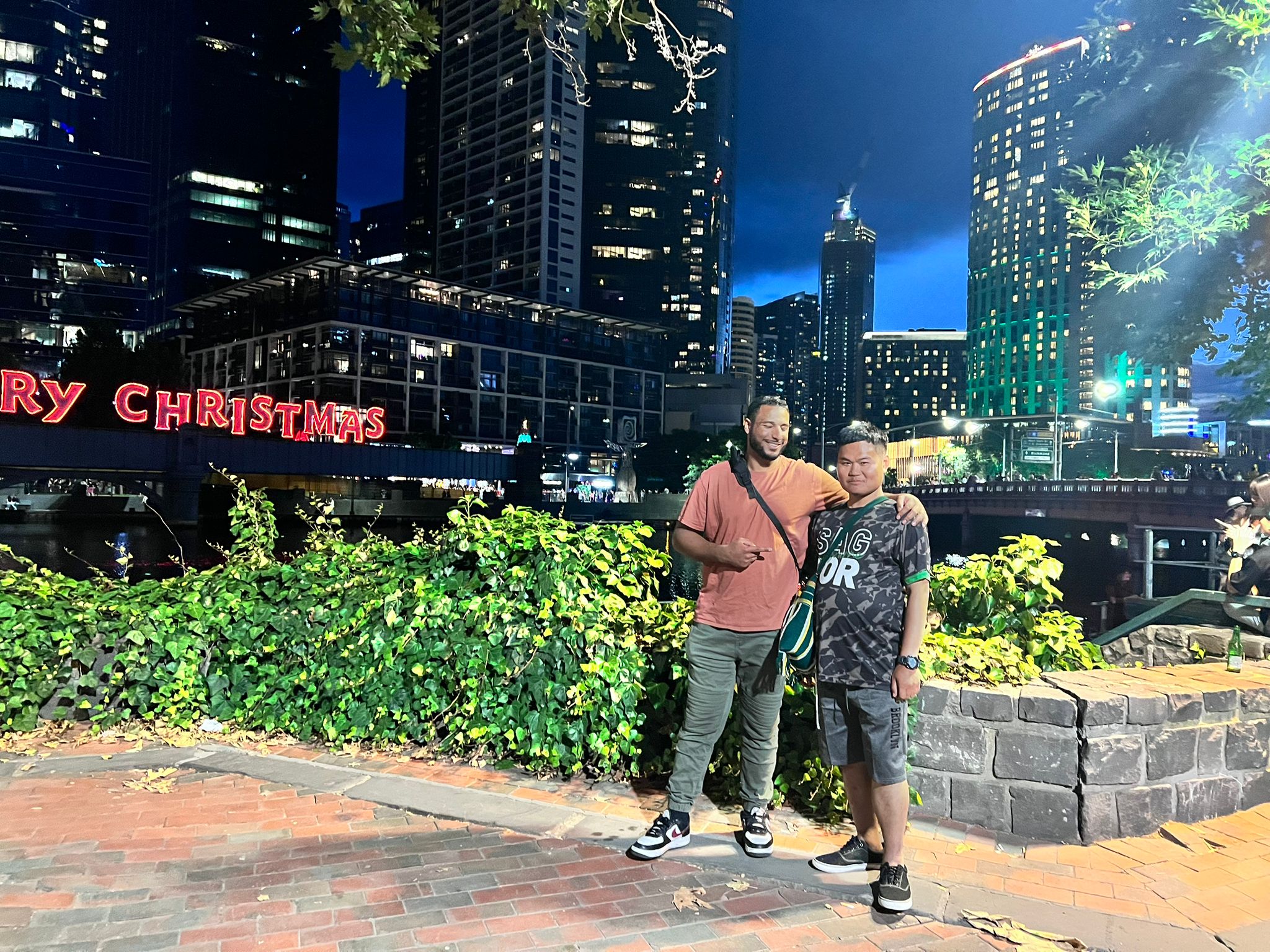 Eh Mui and Habsi in city at night